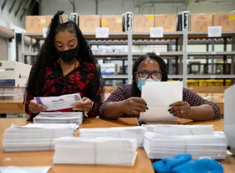 Black Female Election Workers - tallying election votes