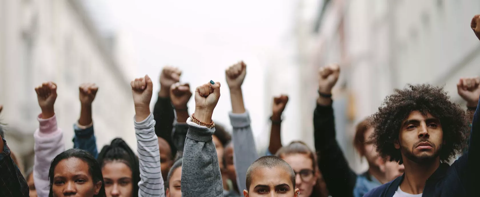 Group Holding Raised Fists in Protest