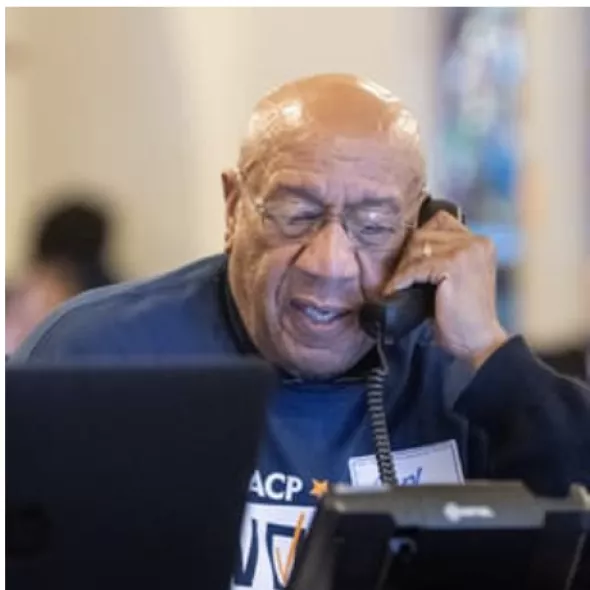 An NAACP volunteer calling voters