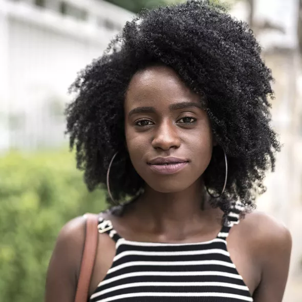 young woman outside smiling