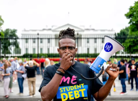 Wisdom Cole student debt protest