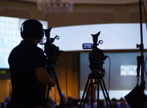 Videographer Filming a Show with a Studio Audience